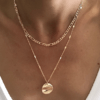 Collier dore a double chaine style gourmette